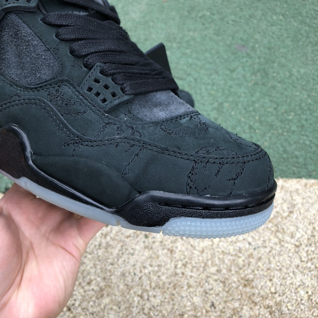 UA Jordan 4 Retro Kaws Black